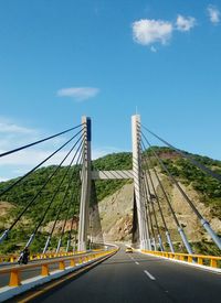 Bridge over road against sky