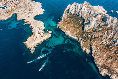 High angle view of rock formation in sea