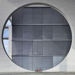 Bicycle parked against built structure