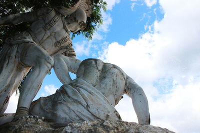 Low angle view of statue against sky