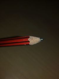 Close up of pencil against black background