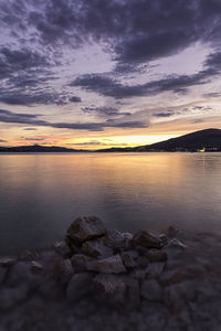 View of calm sea against cloudy sky