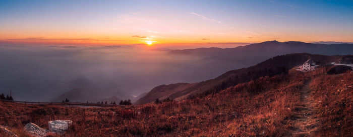 Scenic view of mountains against sky during sunset