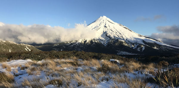 Scenic view of snowcapped mountains against sky