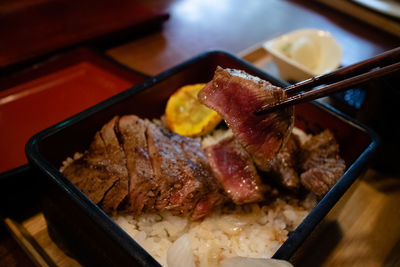 High angle view of meat in plate on table