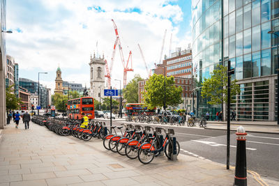 Bicycles parked on sidewalk in city