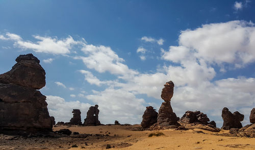 Panoramic view of rock formations against sky