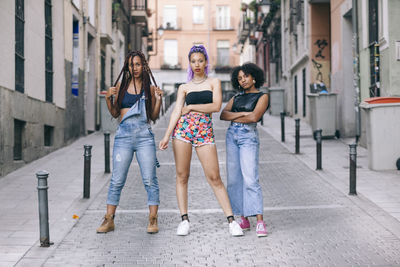 Portrait of female friends standing on street