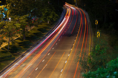 High angle view of light trails on road at night
