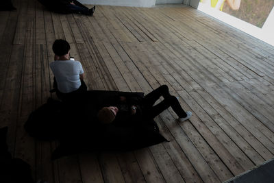 High angle view of boy on floor