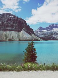 Scenic view of lake against cloudy sky