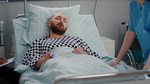 Nurse examining patient at hospital