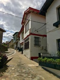 Empty alley amidst buildings in town