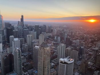 Aerial view of cityscape during sunset