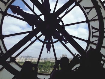 Low angle view of ferris wheel against sky