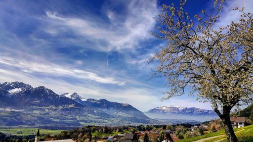 Scenic view of mountains against cloudy sky