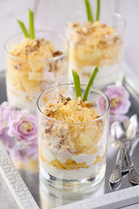 Chicken salad with pineapple, corn, seasoned with greek yogurt, crushed nuts and grated cheese. 