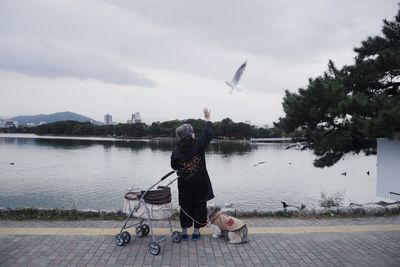 Full length of woman in water against clear sky