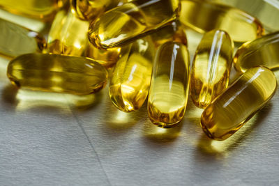 Close-up of cod liver oil capsules on table