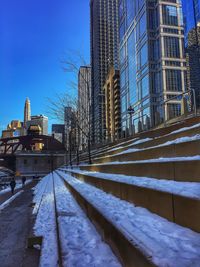 Railroad tracks in city during winter