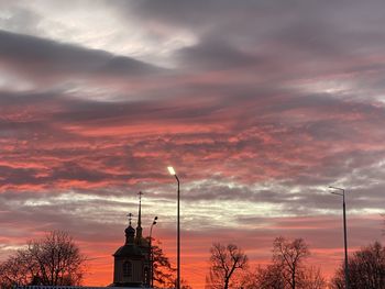 Low angle view of buildings against sky during sunset