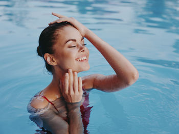 Young woman swimming in pool