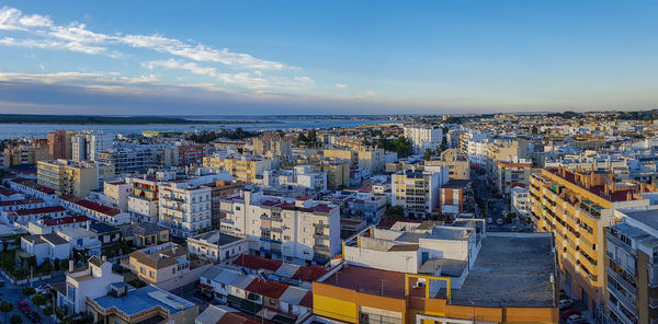 High angle view of city buildings against sky