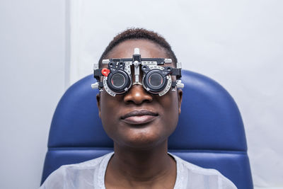 Black woman in optometry cabinet during study of the eyesight