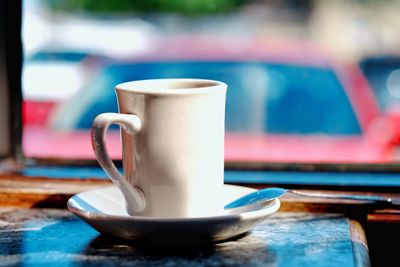 Close-up of coffee cup on table