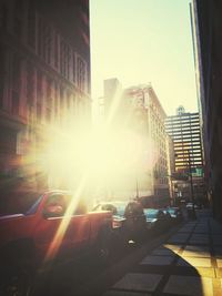 Buildings in city at sunset