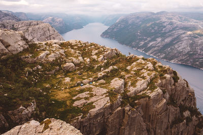 View of camping tents near edge of cliff in norway