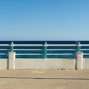 Scenic view of sea against clear blue sky