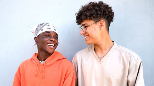 Black african man smiling to colombian man