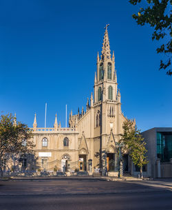 Low angle view of cathedral against clear blue sky