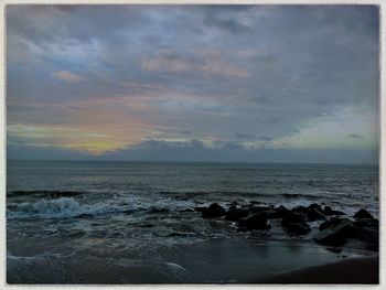 Scenic view of sea against sky during sunset