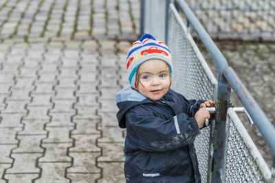 Portrait of boy standing in snow