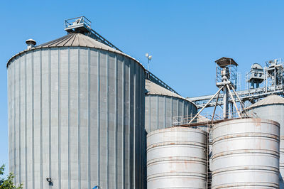 Low angle view of water tower against clear sky