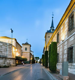 Road leading towards cathedral against clear sky