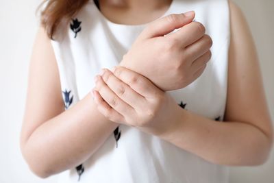 Close-up of woman holding hands