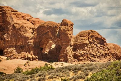 Rock formations on landscape against sky