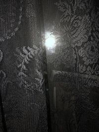 Full frame shot of illuminated tree against bright sun