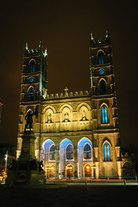 Low angle view of illuminated building at night