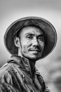 Portrait of man wearing hat against sky