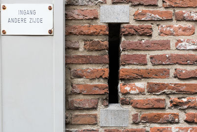 Close-up of old fashioned mailbox in brick wall, utrecht, the netherlands