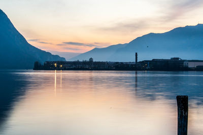 Scenic view of lake against sky during sunset