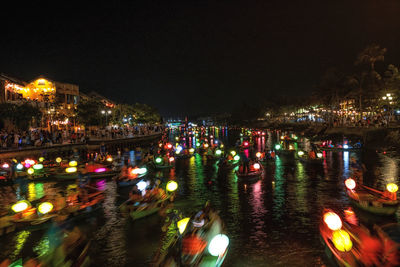 High angle view of illuminated buildings in city at night