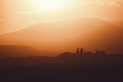 Scenic view of mountains at sunset