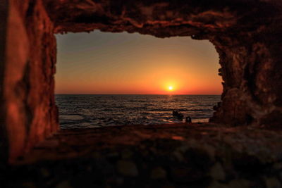 Scenic view of sea at sunset