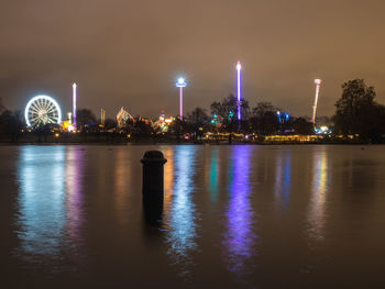 Illuminated buildings at waterfront
