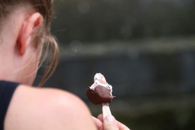 Close-up of woman holding ice cream